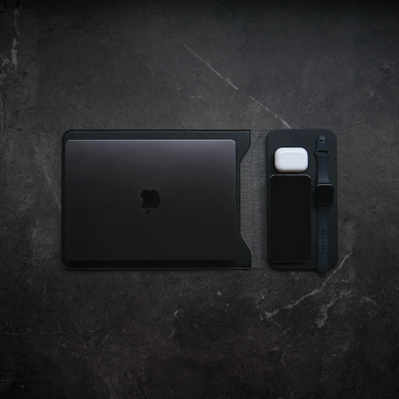 NODE. Minimalist Black Laptop Sleeve with Apple Magsafe compatible charging docks for iPhone, Airpods and Apple Watch.