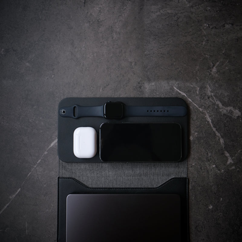 NODE. Minimalist Black Laptop Sleeve with Apple Magsafe compatible charging docks for iPhone, Airpods and Apple Watch.