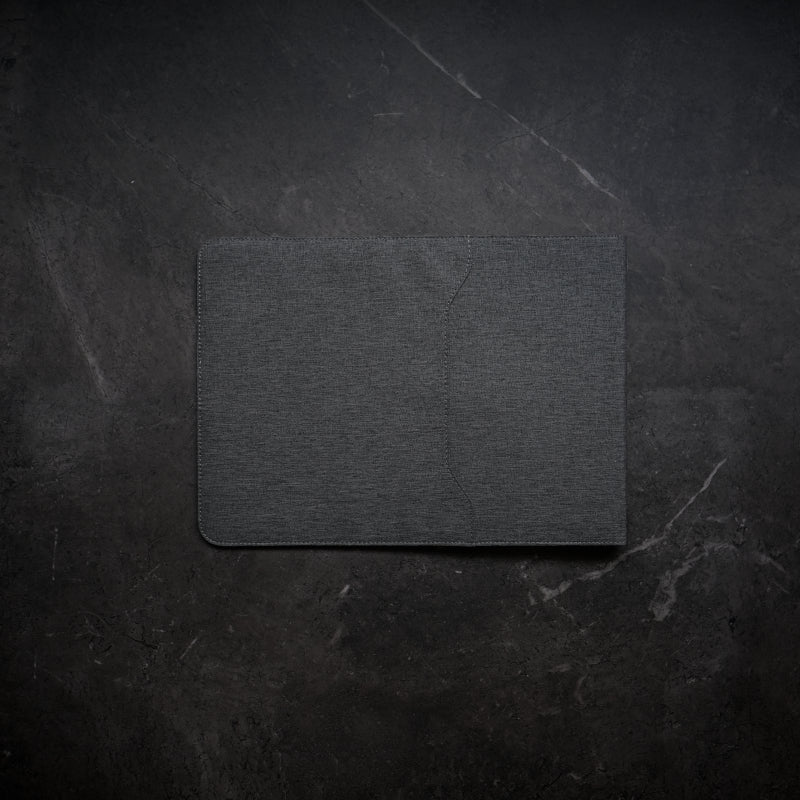 NODE. Minimalist Black Laptop Sleeve with Apple Magsafe compatible charging docks for iPhone, Airpods and Apple Watch.
